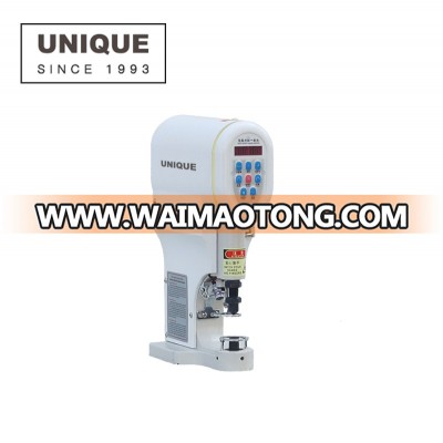 Electronic snap button attaching machine